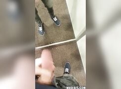 Skinny 19-year-old boy jerks his uncircumcised cock in a dressing room