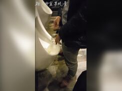 Males are pissing in the toilet 2