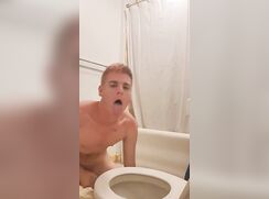 Horny twink workships a toilet